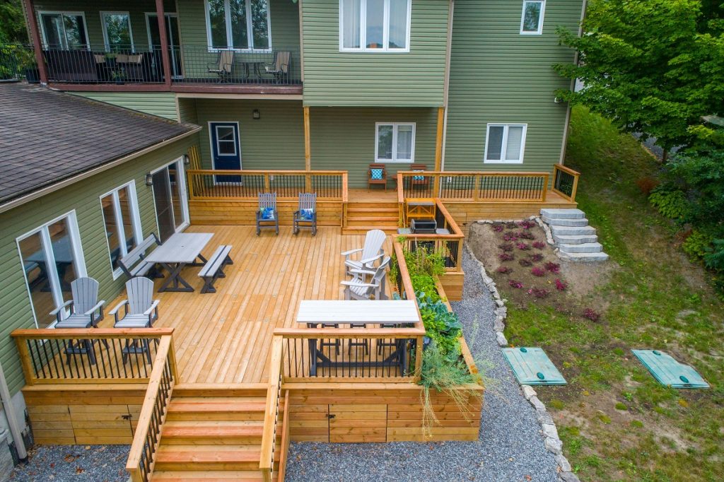 aerial view of a home with a spacious deck